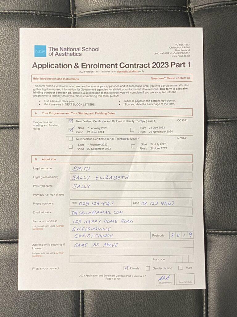 An example of an unacceptable photo of an application form. The form has too large of a margin around it, and the sheet is crumpled.